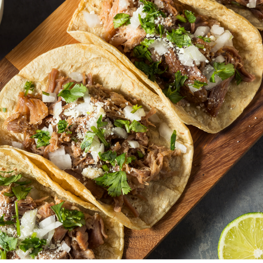 tacos with cilantro and cotija on top